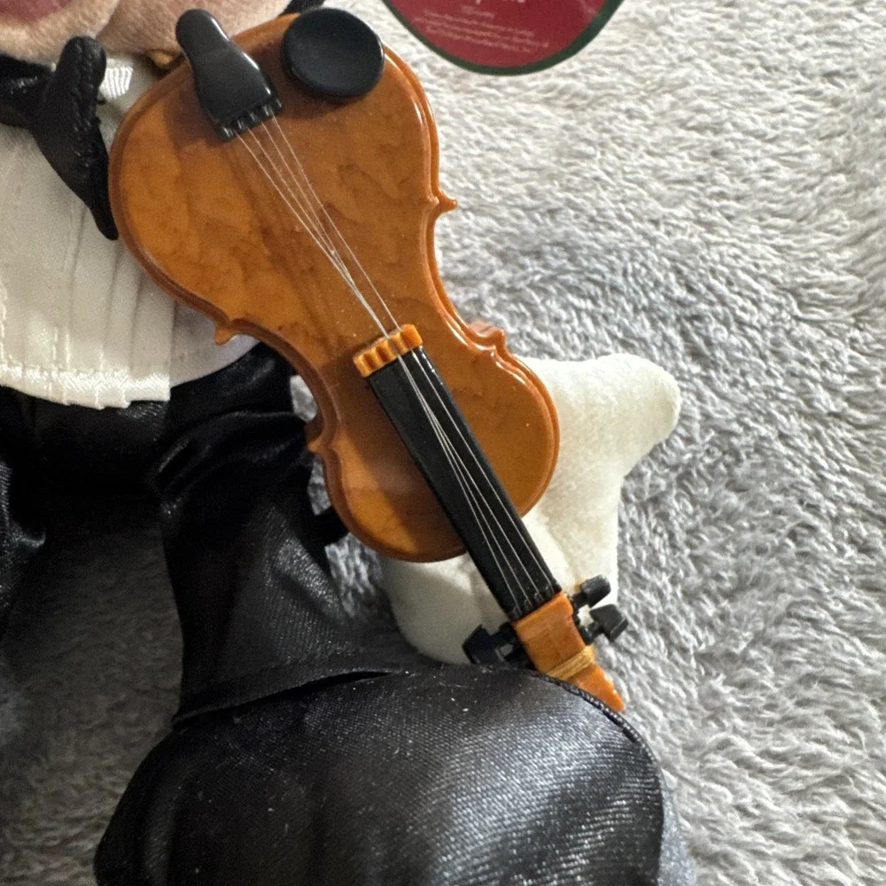 Mickey Mouse In A Tuxedo With A Violin Playing‎ A Violin